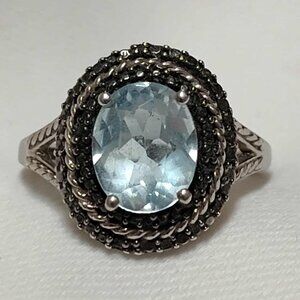 3.10ct‎ Blue Topaz w/ .01ctw Round Black Diamond Accent Rhodium over Silver ring